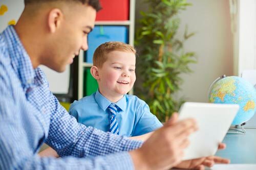 Tutor with happy pupil